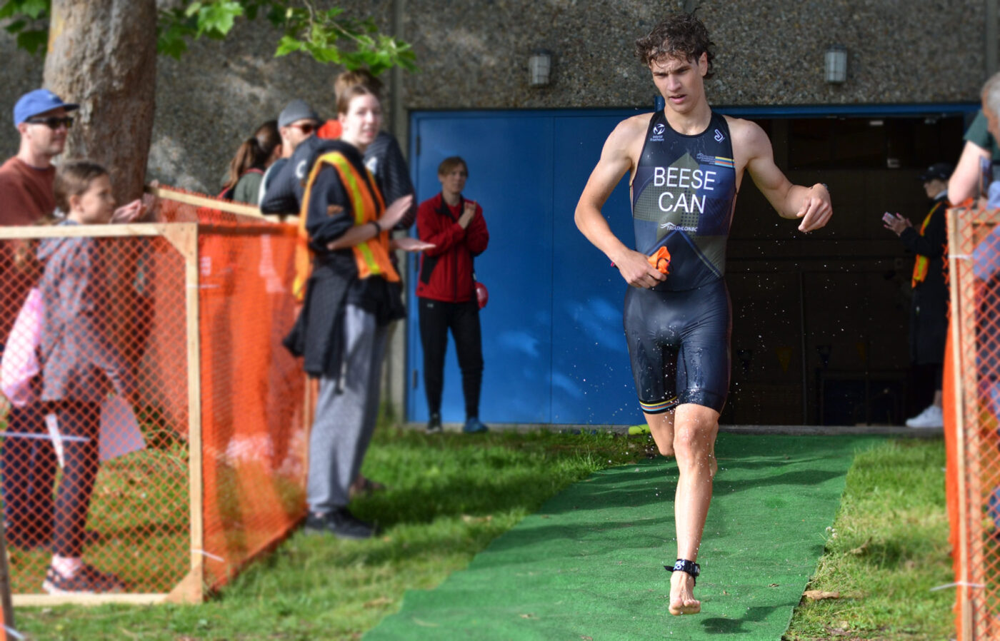 A racer comes ripping out of the pool at the Victoria Youth Triathlon at UVic.